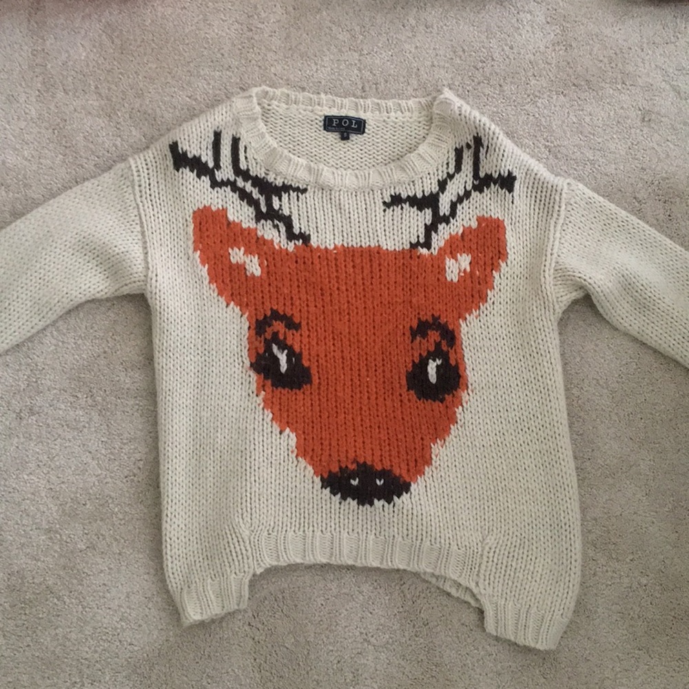 Off white, thick knit sweater with a deer on it